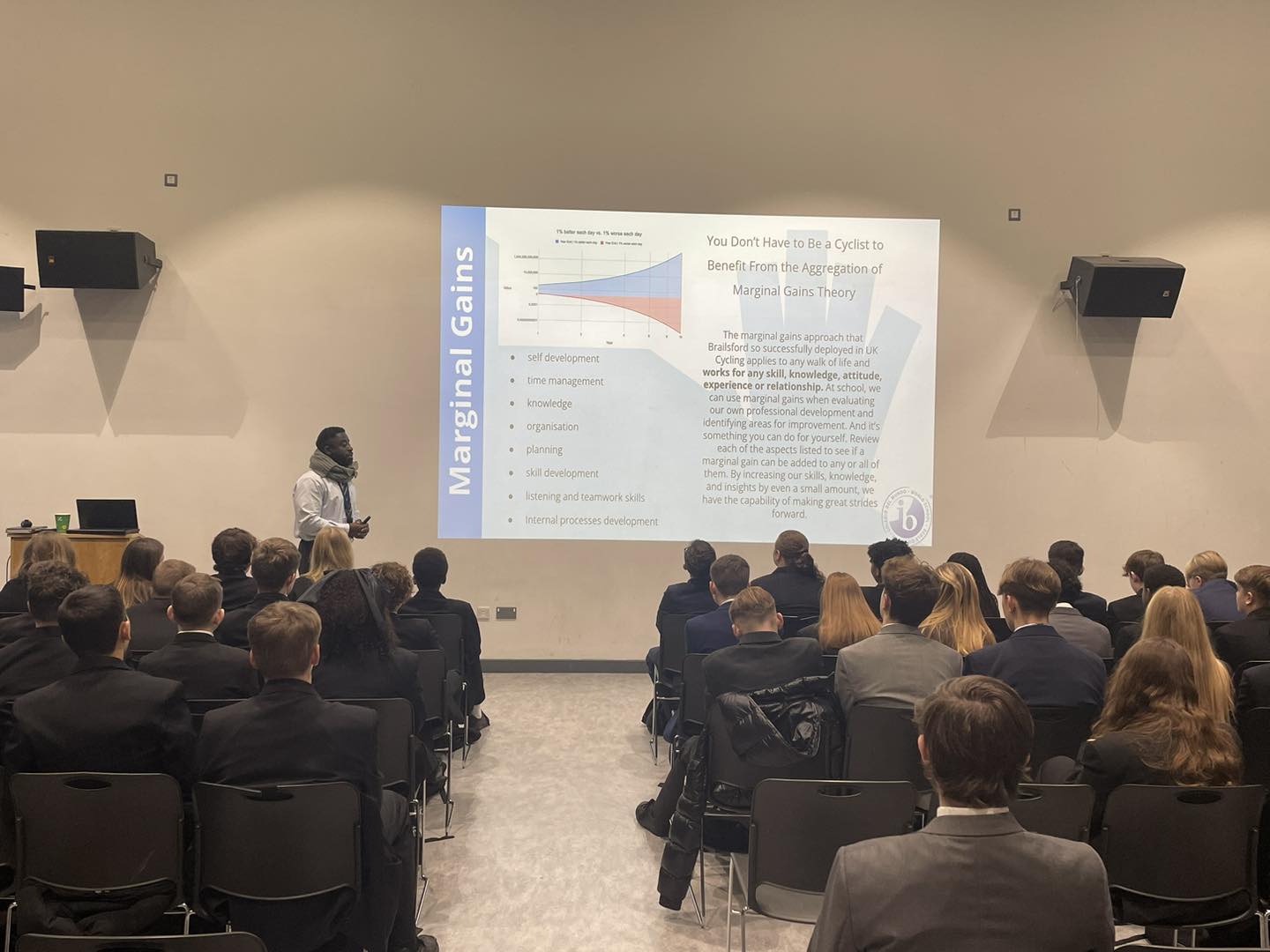 Students sitting in a hall watching a presentation