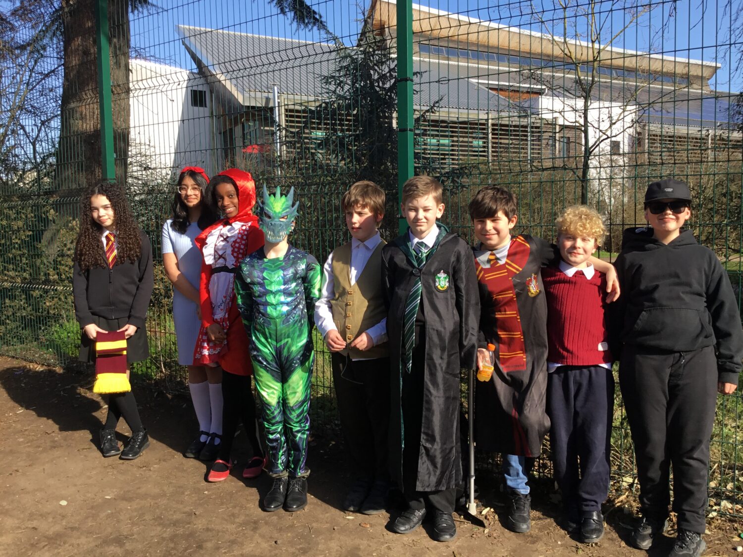 Students stood outside in a line dressed as various book characters for World Book Day 2025